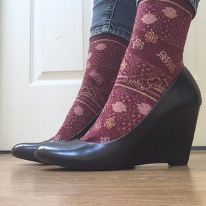 Black leather wedge pumps